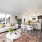Spacious living rooms with large windows and open concept kitchens