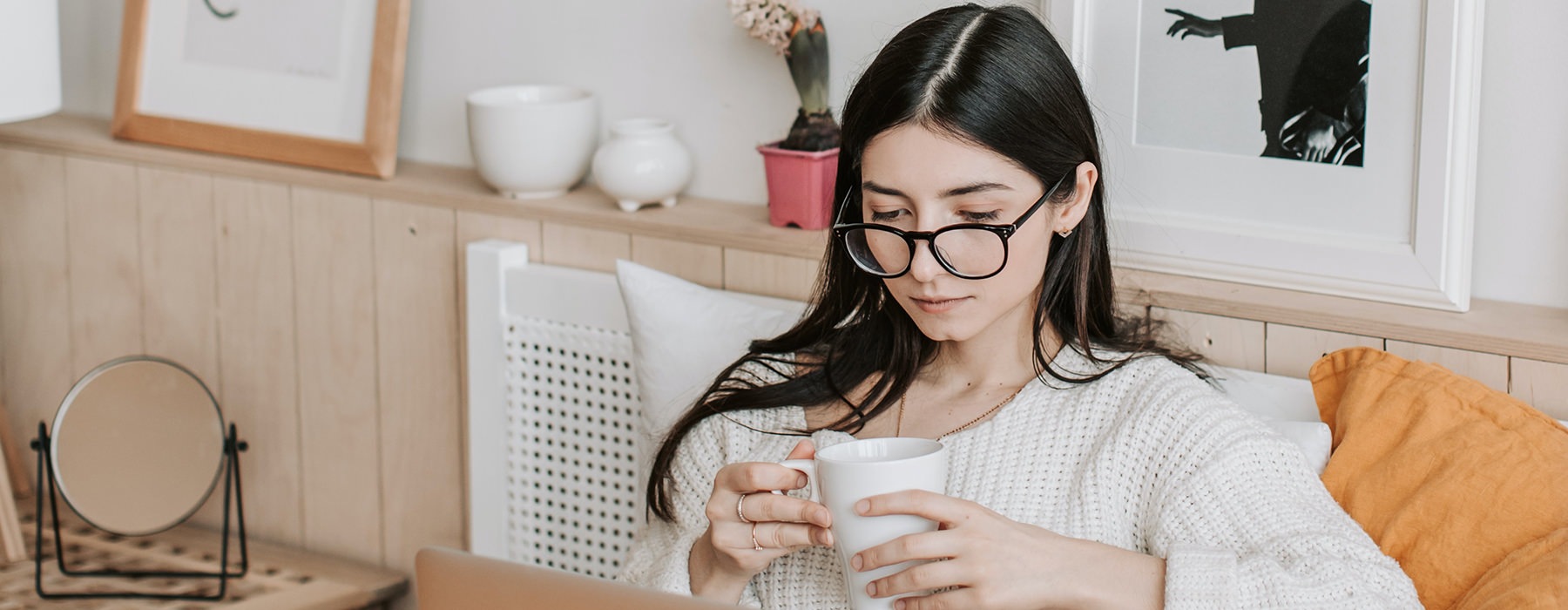 Woman enjoying a cup of coffee in a local cafe